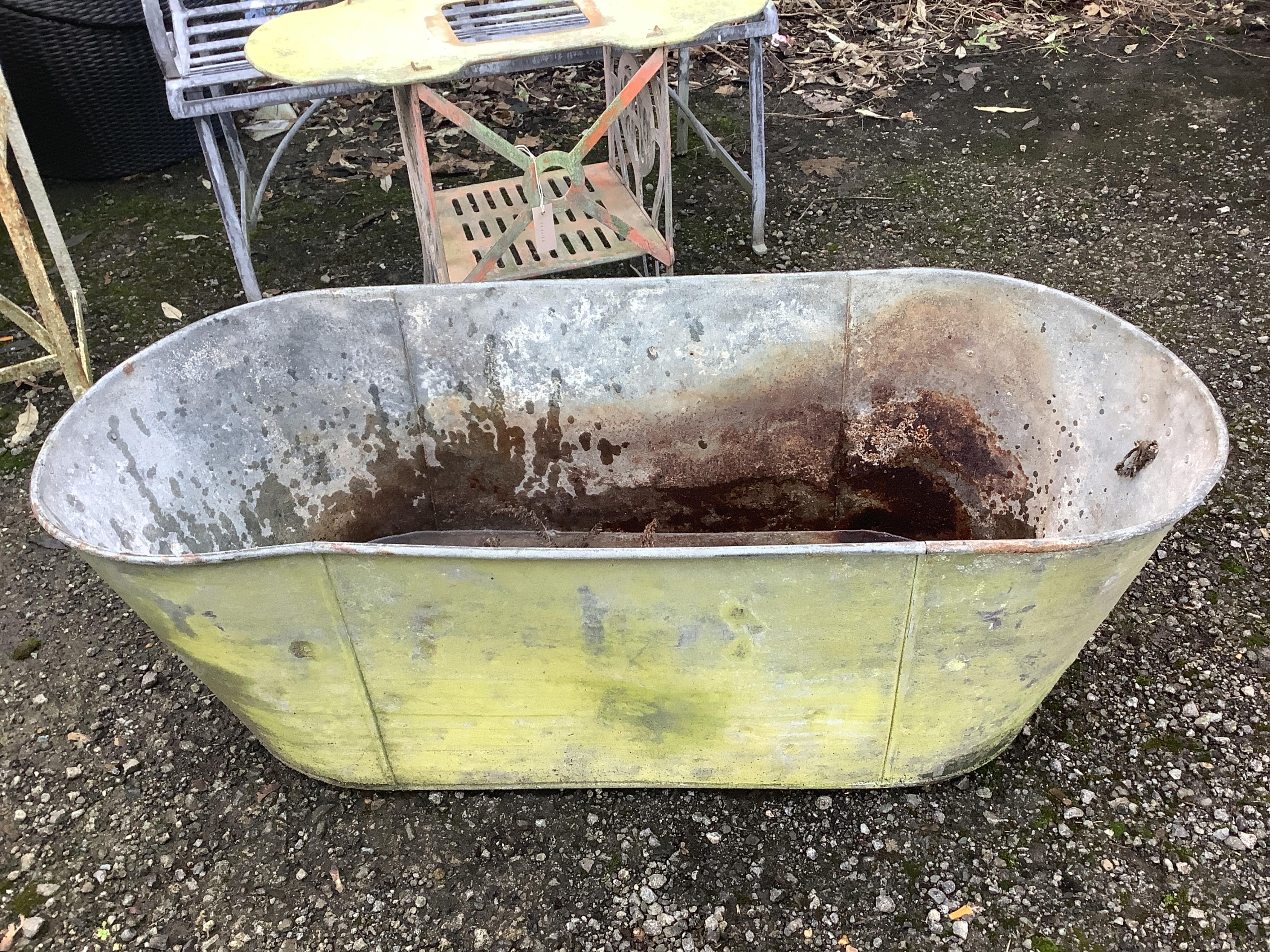 A vintage galvanised bath, width 126cm, depth 52cm, height 40cm. Condition - fair